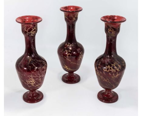 Three ruby glass vases
