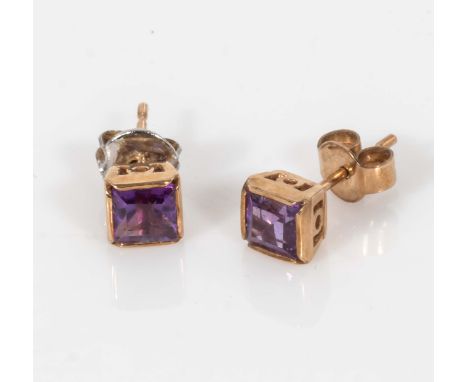 A pair of 9ct gold earrings set with amethyst