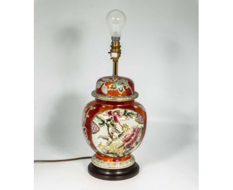 An Oriental style pottery table lamp with floral design 30cm tall