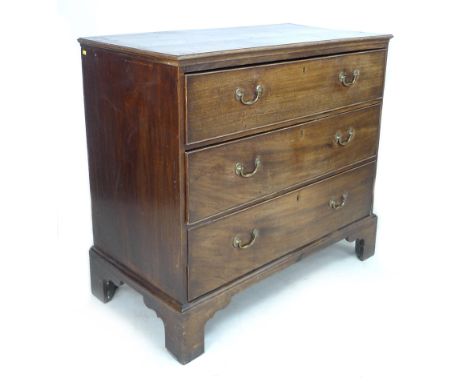 A George III mahogany chest of three graduating drawers, with brass swan neck handles, raised on bracket feet,  by  by cm hig