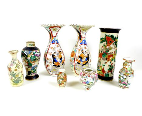 A group of Chinese and Japanese vases, comprising a Chinese sleeve vase, early 20th century, decorated with warriors below a 