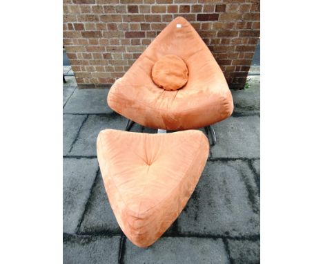 A LARGE  EASY CHAIR AND MATCHING POUFFE  on chrome tubular steel supports, upholstered in orange faux suede