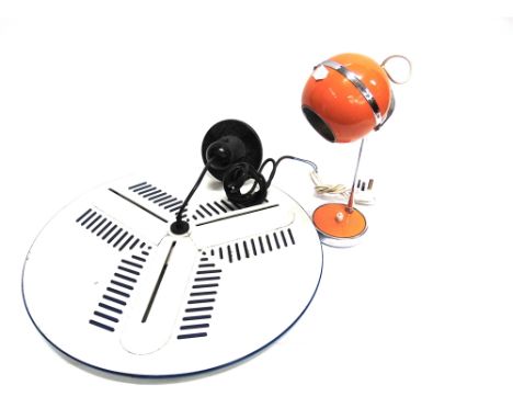 A CHROME AND ORANGE COLOURED RETRO DESK LAMP  with swivelling spherical shade, 35cm high; together with an Italian three ligh