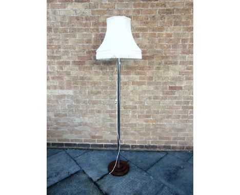 A CHROME LAMP STANDARD  on circular stepped wooden base, 154cm high excluding electrical fitting and shade