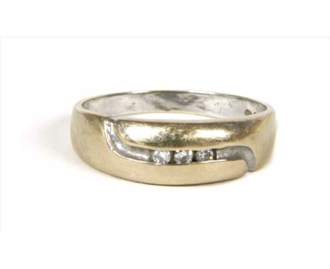 A white gold diamond ring, with a row of brilliant cut diamonds channel set to the tapered head, with plain shank, marked 750