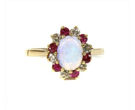 A 9ct gold opal, diamond and ruby cluster ring, with an oval cabochon opal, claw set to surround of alternating brilliant cut