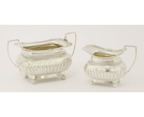 A Victorian silver sugar bowl and milk jug , Alfred Benson and Henry Hugh Webb, London, 1893, the partly gadrooned bodies dou