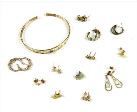A 9ct gold garnet bangle, Birmingham, common convention mark, together with twelve pairs of stud and hoop earrings, all hallm
