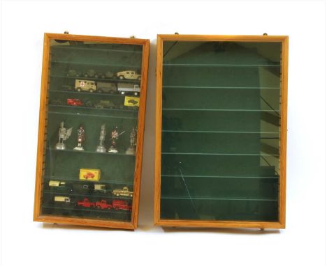 Two shallow hanging pine display cabinets , with eight Dinky and Corgi Land Rovers, including one gold coloured, fourteen var