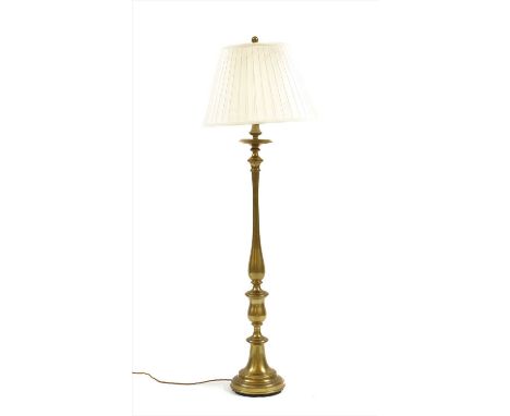 A Ralph Lauren brass standard lamp, of turned baluster form on a stepped circular base, with applied brass plaque with pleate