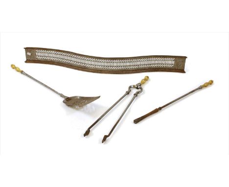 A set of three steel fire irons, with cast gilt handles, poker, 71cm long, and a steel serpentine fender, 110cm long (4)