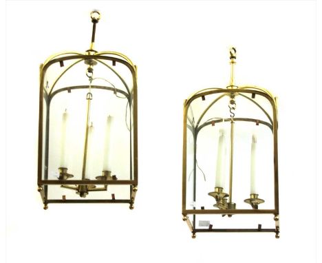 A pair of brass three light hall lanterns, 60cm high