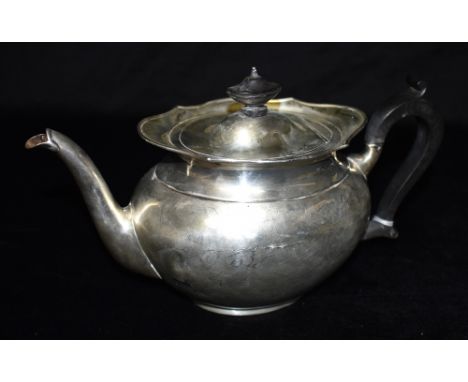 A SILVER TEAPOT The plain oval form with hardwood handle and knop, Sheffield hallmarked for 1916, gross weight approx. 16.6 o