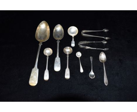 A QUANTITY OF ASSORTED SPOONS AND SUGAR TONGS Comprising a fiddle pattern caddy spoon 1838 by Joseph Willmore, 2 pairs of sug