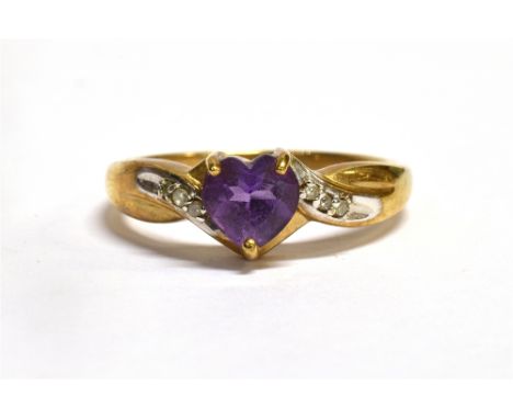 A HEART SHAPED AMETHYST SET 9CT GOLD RING  with diamond set twist shoulders, size O, gross weight approx. 2.0grams