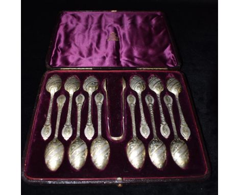 A CASED SET OF ELKINGTON &amp; CO TEASPOONS AND TONGS The 12 silver gilt teaspoons with sugar tongs with diagonal floral engr