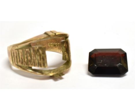 A 9CT GOLD GARNET DRESS RING  The hallmarked ring with bark effect shoulders, size P, gold weight approx. 5.6 grams Note: the