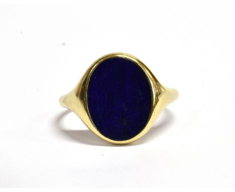 GENT'S 9CT GOLD LARGE SIGNET RING The front comprising an oval sodalite 17mm x 12 mm to hallmarked 9ct gold shank size Z, gro