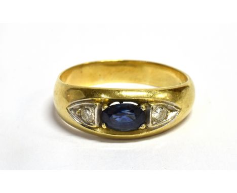 A SAPPHIRE AND DIAMOND THREE STONE RING The central opal cut sapphire with two small diamonds, one each side, claw set within