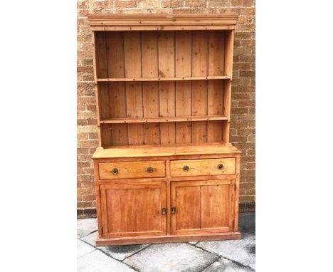 VICTORIAN PINE DRESSER, with a two shelf plate rack with panelled back above a base with two drawers above two cupboards and 