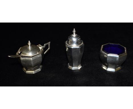 AN ART DECO MAPPIN &amp; WEBB THREE PIECE SILVER CONDIMENT SET The tapered faceted design comprising mustard pot, pepperette 