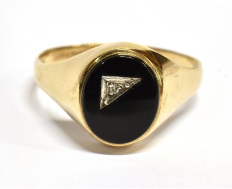 A GENTS ONYX 9CT GOLD SIGNET RING The oval onyx head inset with a very small diamond to a hallmarked 9ct gold shank size Z + 