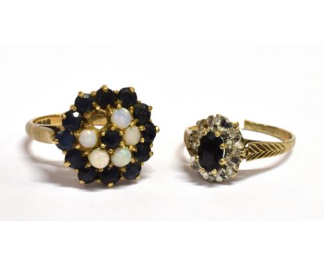 TWO SAPPHIRE SET 9CT GOLD DRESS RINGS Comprising an oval and Sapphire and small diamond cluster both as found, one with opal 