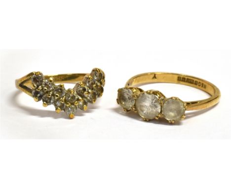 TWO 9CT GOLD WHITE STONE SET DRESS RINGS comprising a three stone size N, and a two row wishbone size K ½, total gross weight