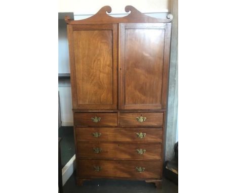 VICTORIAN MAHOGANY LINEN PRESS, the upper section having scrolled pediment above a pair of doors opening to reveal three slid