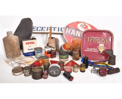 A mixed selection of motoring-related items comprising a Honda CB 125 bike seat, Hancock Gasoline sign, original Esso labels 
