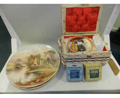 A pair of English late 19th/early 20th century circular chargers, painted with landscape ruins together with a sewing box con