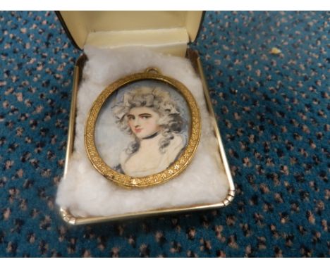 After Richard Cosway, a portrait miniature on ivory of a lady, head and shoulders, dated 1784