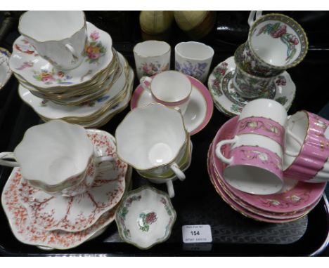 Three trays of assorted Coalport cups and saucers, both tea and coffee, including an unusual plain white example decorated wi