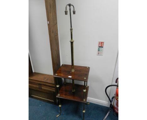 An Edwardian brass and grained rosewood what-not lamp standard, the two rectangular shelves on brass corner support and four 