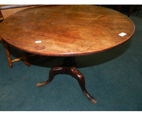 A George III mahogany tilt-top supper table on tripod base.