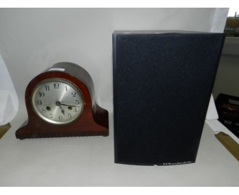 A mantel clock with Arabic numeral dial and a Wharfedale Diamond speaker