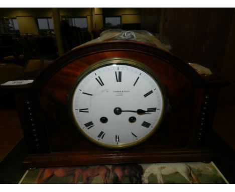 An early 20th century mahogany eight day mantle clock.