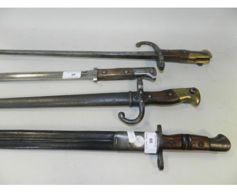 Two French M1874 Epee Gras bayonets, one with scabbard, together with a WW1 1913 Pattern P14 Rifle Remington made Bayonet and