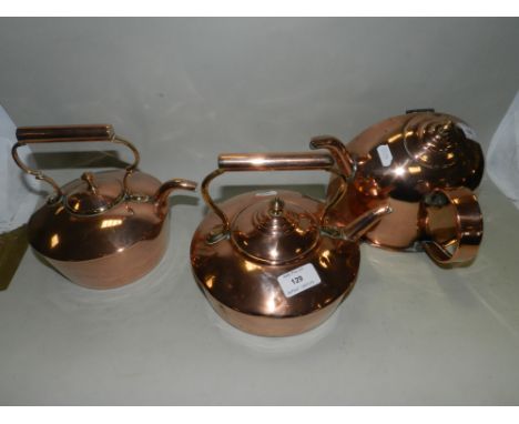 Two small copper kettles, late 19th/early 20th century, together with a further half wall hanging copper kettle (3)