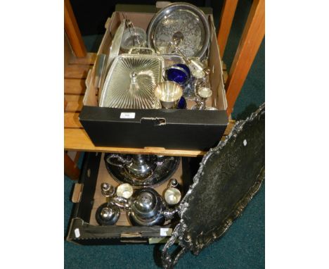 Two boxes of assorted silver-plated wares to include; teapot, two circular trays, candelabra, goblets, rectangular serving di