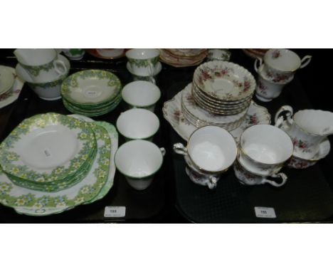 A Melba Bone China part tea service decorated with green and yellow flowers, together with a Royal Albert Lavender Rose tea s