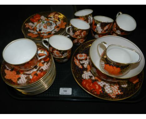 A Royal Crown Derby Imari part tea service, pattern 2444, comprising eleven teacups, twelve saucers, cream jug, waste bowl, t