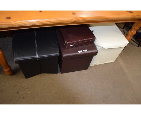 Three leatherette upholstered storage stools and a briefcase