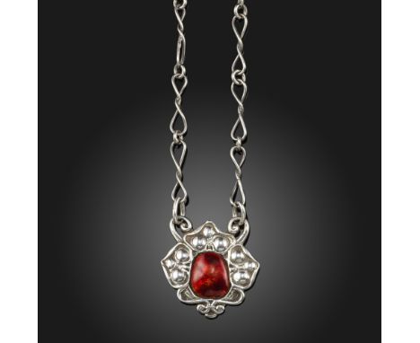 A silver and red enamel pendant by Ramsden &amp; Carr, the silver trefoil decorated with red enamel to the centre, on fancy-l