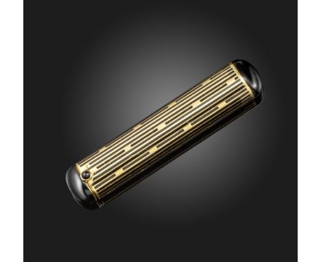 An Art Deco gold lipstick holder by Cartier, of cylindrical form, with black enamel decoration and cabochon onyx push piece, 