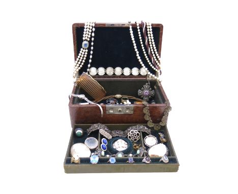 A leather jewellery box containing a quantity of jewellery, including a lady's diamond-set white gold dress watch by Jaeger L