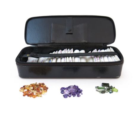 A large quantity of loose semi-precious stones, including aquamarines, peridots, turquoise, coral, jade, amethysts, citrines,