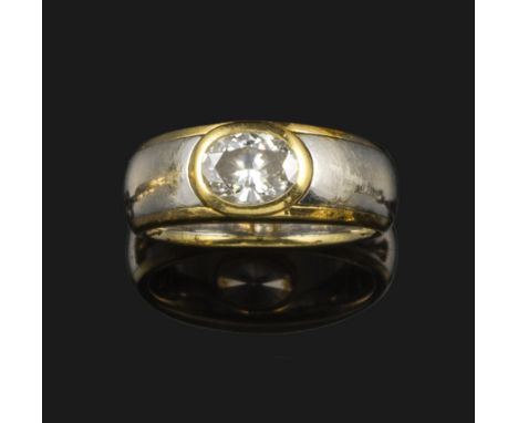 A diamond solitaire ring, the oval-shaped diamond weighs approximately 0.95cts and is rubover-set in platinum and yellow gold