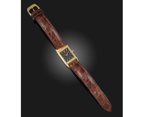 A 18ct yellow gold Reverso wristwatch by Jaeger LeCoultre, signed black enamel dial with baton numerals and Arabic numerals a
