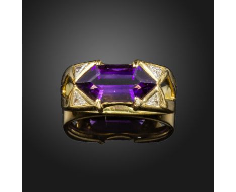 An amethyst and diamond ring, the hexagonal amethyst is set with two triangular diamonds to each shoulder in yellow gold, siz